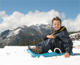 Lio sledding in the Dolomites.
