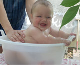 Lio, at seven months, having a bath at the Mill.