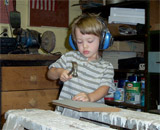 Lio in his grandfather's workshop.